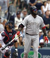 Boston Red Sox's David Ortiz (34) watches as he hits a deep sacrifice fly to bring in the go ahead run during the seventh inning of a baseball game against the Atlanta Braves on Monday, May 26, 2014, in Atlanta, Ga. (AP