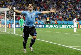 Uruguay's Luis Suarez celebrates after scoring his side's second goal during the group D World Cup soccer match between Uruguay and England at the Itaquerao Stadium in Sao Paulo, Brazil, Thursday, June 19, 2014. (AP