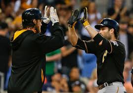 Pittsburgh Pirates' Neil Walker, right, is congratulated by Gerrit Cole after his two-run home run against the San Diego Padres in the third inning of a baseball game Tuesday, June 3, 2014, in San Diego. (AP