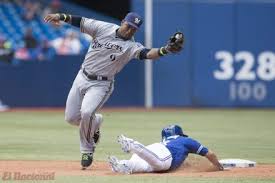 Milwaukee Brewers Jean Segura (9) forces out Toronto Blue Jays Steve Tolleson at second base on a fielder's choice during the eighth inning of a baseball game, Wednesday, July 2, 2014 in Toronto. (AP 