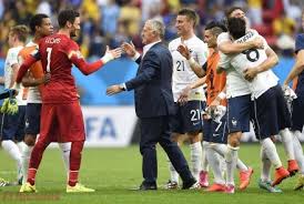 France's coach Didier Deschamps (3L) celebrates with France's goalkeeper and captain Hugo Lloris (L) and other teammates after victory in the Round of 16 football match between France and Nigeria at Mane Garrincha National Stadium in Brasilia during the 2014 FIFA World Cup on June 30, 2014. AFP