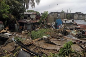 Residents search for their belongings in their damaged houses in San Cristobal, Dominican Republic after they were flooded by an overflowed river due to the passing of Hurricane Irene on Wednesday, Aug. 24, 2010. Flooding, rising rivers and mudslides have prompted the Dominican Republic government to evacuate nearly 38,000 people and more slides were likely in coming days because of days of intense rain from the storm system. (AP Photo/Roberto Guzman)